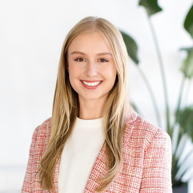 A headshot of Riley Johnson