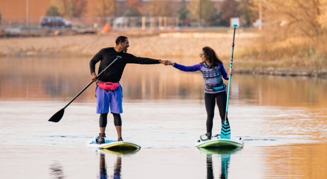 Two people on paddle boards on Lake Lorraine in Sioux Falls SD