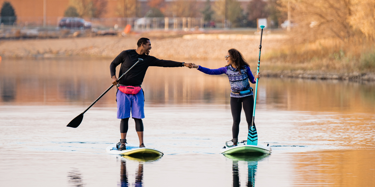 Two people on paddle boards on Lake Lorraine in Sioux Falls SD