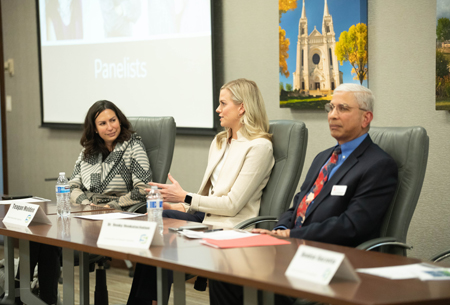 A picture of three panelists at a recruitment council meeting