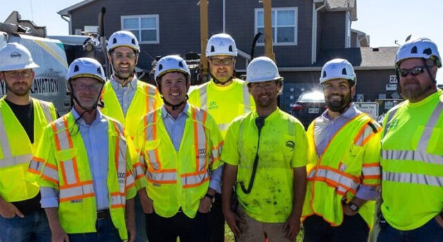 A photo of workers in safety gear