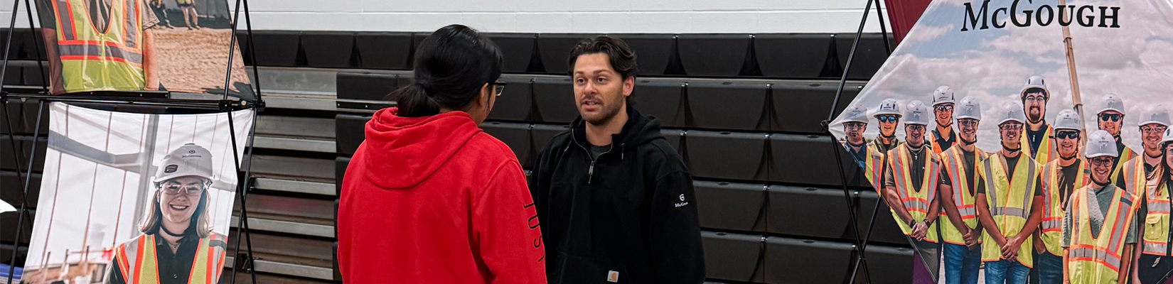 A photo of a student speaking to a representative from McGough at Talent Draft Day