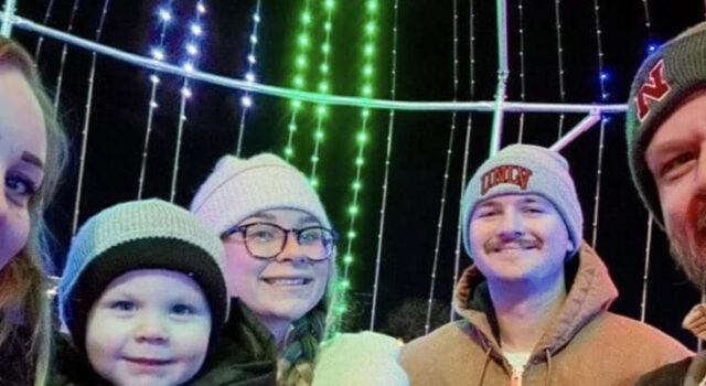 A photo of the Jenkins family in front of Christmas lights
