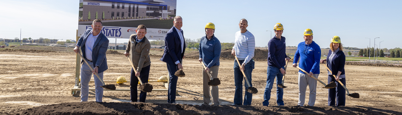A photo of people holding shovels at the Interstates groundbreaking