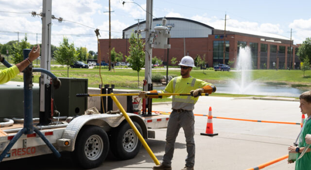 A photo of students observing a live wire demonstration by Sioux Valley Energy at Your Future STEM Summer Day Camps 2026