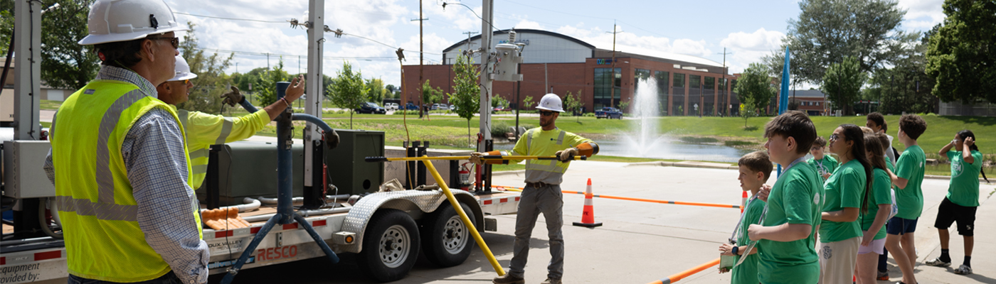 A photo of students observing a live wire demonstration by Sioux Valley Energy at Your Future STEM Summer Day Camps 2026