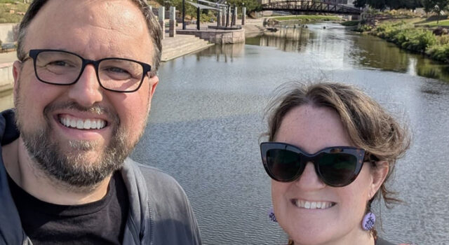 Matthew Flaten and Laura Dean with the Big Sioux River in Downtown Sioux Falls in the background