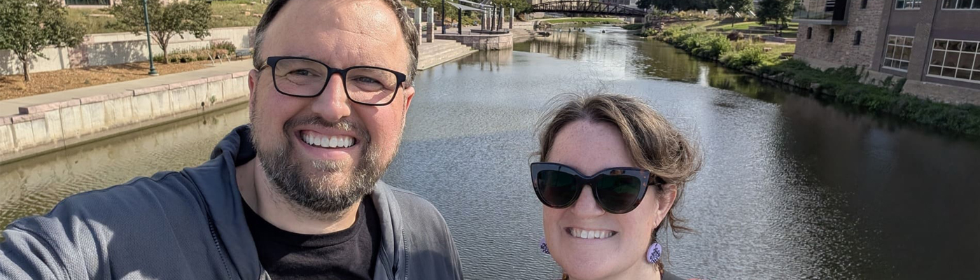 Matthew Flaten and Laura Dean with the Big Sioux River in Downtown Sioux Falls in the background